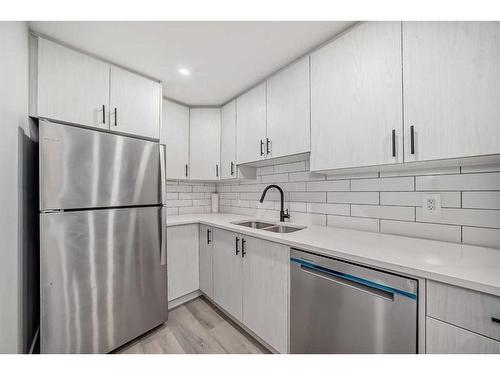 119 Creekstone Drive Sw, Calgary, AB - Indoor Photo Showing Kitchen With Stainless Steel Kitchen With Double Sink With Upgraded Kitchen