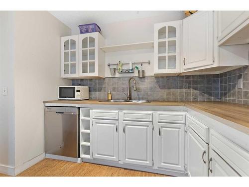 9N-203 Lynnview Road Se, Calgary, AB - Indoor Photo Showing Kitchen With Double Sink