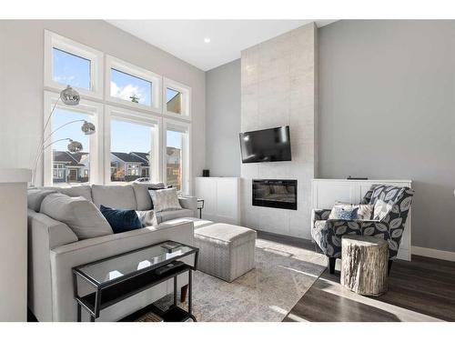 16 D'Arcy Boulevard, Okotoks, AB - Indoor Photo Showing Living Room With Fireplace