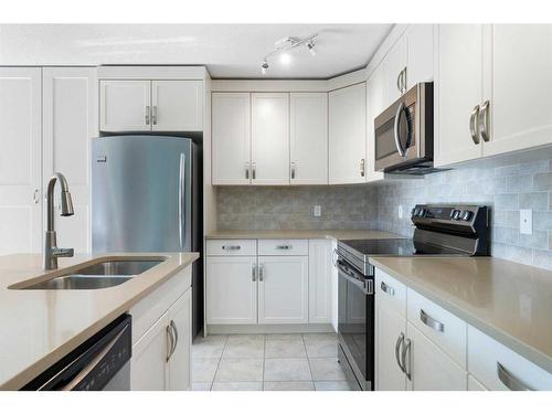 13 Chaparral Valley Gardens Se, Calgary, AB - Indoor Photo Showing Kitchen With Stainless Steel Kitchen With Double Sink With Upgraded Kitchen