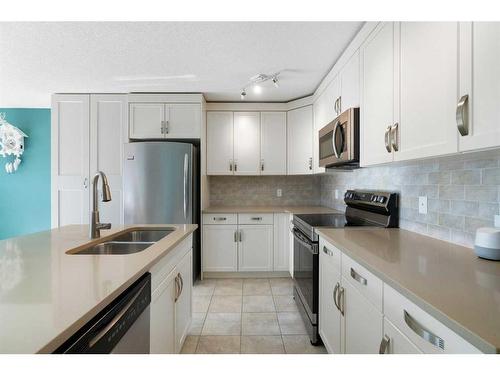 13 Chaparral Valley Gardens Se, Calgary, AB - Indoor Photo Showing Kitchen With Stainless Steel Kitchen With Double Sink With Upgraded Kitchen