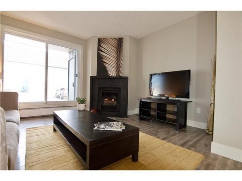 9108-315 Southampton Drive Sw, Calgary, AB - Indoor Photo Showing Living Room With Fireplace