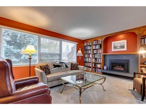 1036 Cannock Place Sw, Calgary, AB - Indoor Photo Showing Living Room With Fireplace