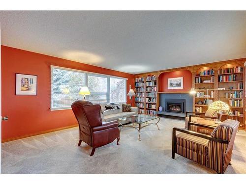 1036 Cannock Place Sw, Calgary, AB - Indoor Photo Showing Living Room With Fireplace