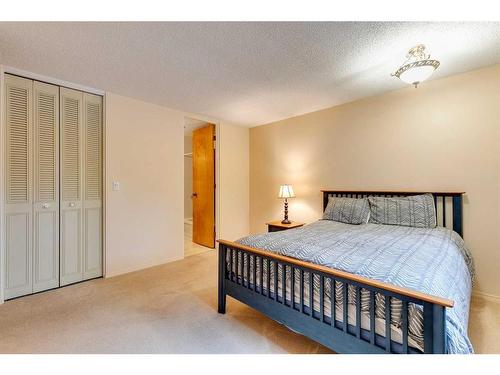 1036 Cannock Place Sw, Calgary, AB - Indoor Photo Showing Bedroom