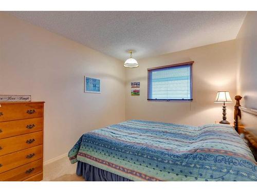 1036 Cannock Place Sw, Calgary, AB - Indoor Photo Showing Bedroom