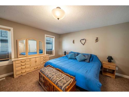 520 Harrison Court, Crossfield, AB - Indoor Photo Showing Bedroom