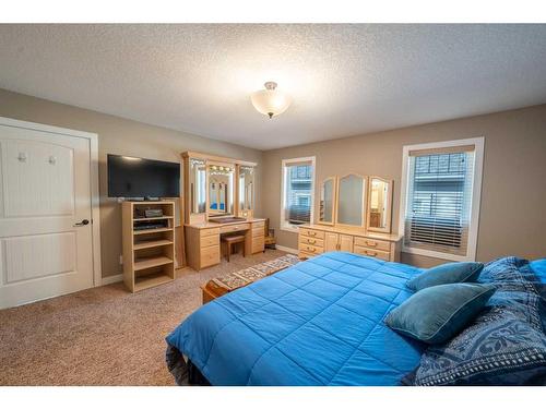 520 Harrison Court, Crossfield, AB - Indoor Photo Showing Bedroom