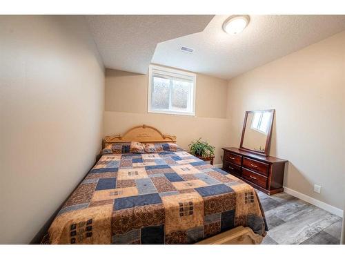 520 Harrison Court, Crossfield, AB - Indoor Photo Showing Bedroom