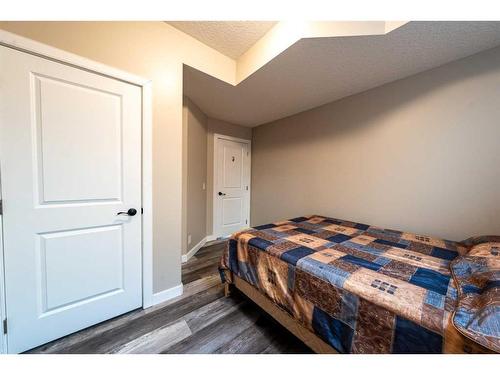 520 Harrison Court, Crossfield, AB - Indoor Photo Showing Bedroom