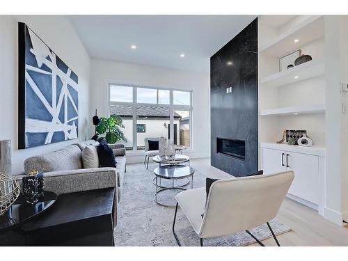 2528 4 Avenue Nw, Calgary, AB - Indoor Photo Showing Living Room With Fireplace