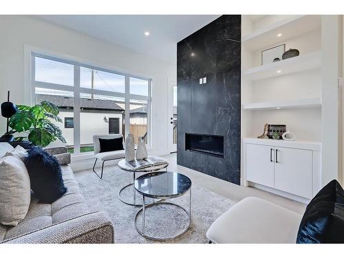 2528 4 Avenue Nw, Calgary, AB - Indoor Photo Showing Living Room With Fireplace