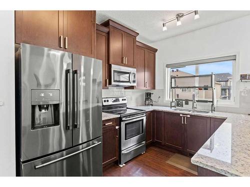 221 Hillcrest Road, Airdrie, AB - Indoor Photo Showing Kitchen With Double Sink