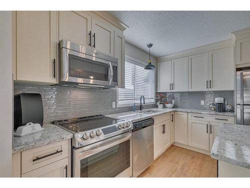 82 Auburn Crest Place Se, Calgary, AB - Indoor Photo Showing Kitchen With Stainless Steel Kitchen With Upgraded Kitchen