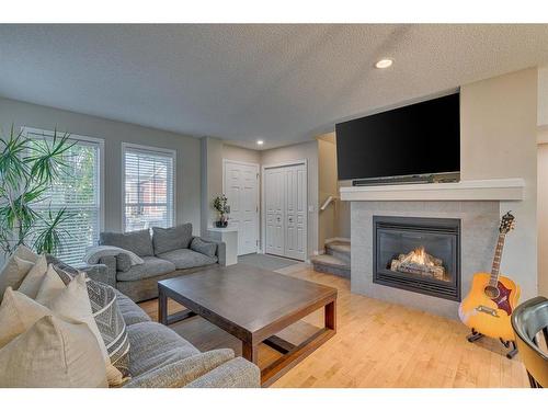 82 Auburn Crest Place Se, Calgary, AB - Indoor Photo Showing Living Room With Fireplace