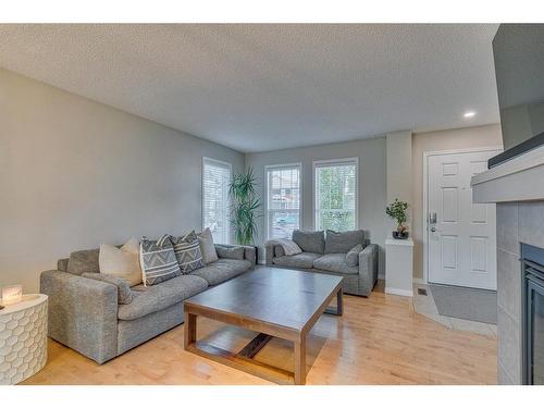 82 Auburn Crest Place Se, Calgary, AB - Indoor Photo Showing Living Room With Fireplace