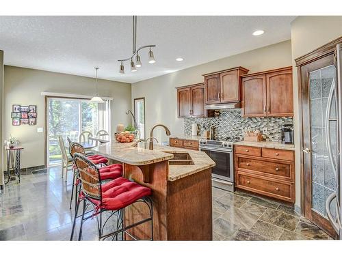 57 Eversyde Manor Sw, Calgary, AB - Indoor Photo Showing Kitchen With Double Sink