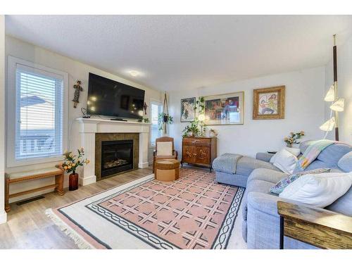 11 Bridlecrest Place Sw, Calgary, AB - Indoor Photo Showing Living Room With Fireplace