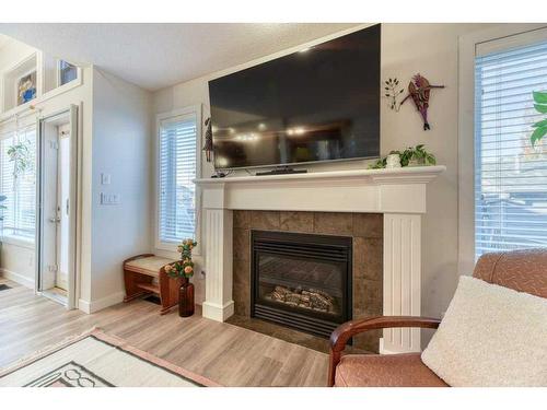 11 Bridlecrest Place Sw, Calgary, AB - Indoor Photo Showing Living Room With Fireplace