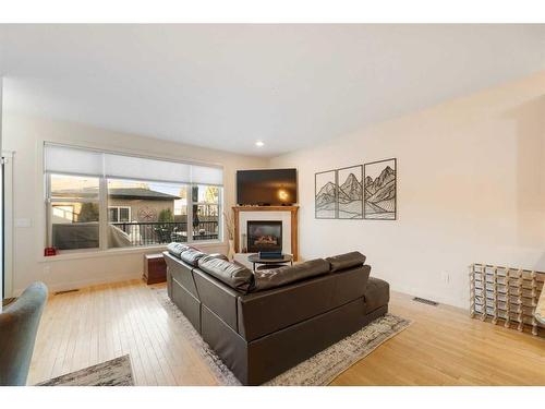 140 41 Avenue Nw, Calgary, AB - Indoor Photo Showing Living Room With Fireplace