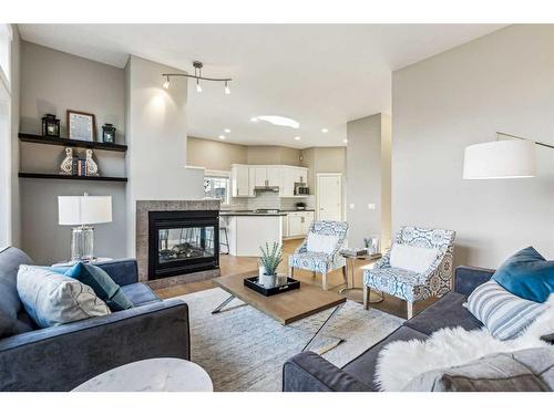 2 Simcrest Grove Sw, Calgary, AB - Indoor Photo Showing Living Room With Fireplace