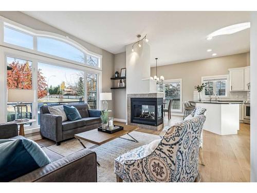 2 Simcrest Grove Sw, Calgary, AB - Indoor Photo Showing Living Room With Fireplace