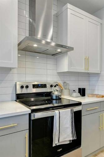 170 Saddlebred Place, Cochrane, AB - Indoor Photo Showing Kitchen With Stainless Steel Kitchen With Upgraded Kitchen