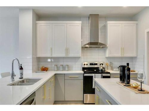 170 Saddlebred Place, Cochrane, AB - Indoor Photo Showing Kitchen With Double Sink With Upgraded Kitchen