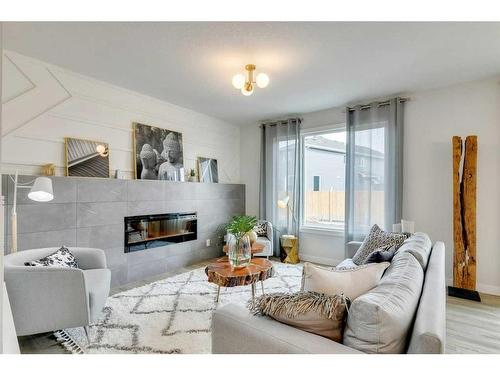 170 Saddlebred Place, Cochrane, AB - Indoor Photo Showing Living Room With Fireplace