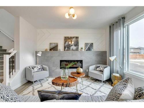 170 Saddlebred Place, Cochrane, AB - Indoor Photo Showing Living Room With Fireplace