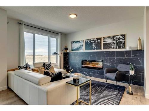 17 Cliff Street, Okotoks, AB - Indoor Photo Showing Living Room With Fireplace