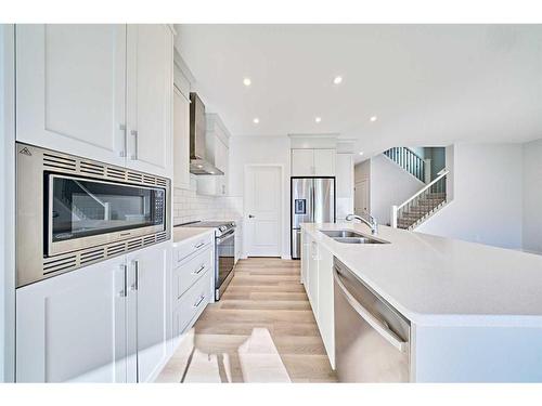 67 Seton Villas Se, Calgary, AB - Indoor Photo Showing Kitchen With Stainless Steel Kitchen With Double Sink With Upgraded Kitchen