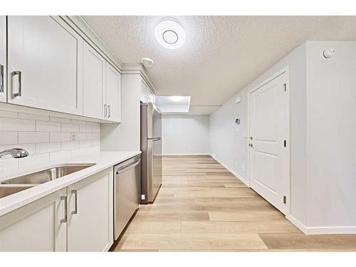 67 Seton Villas Se, Calgary, AB - Indoor Photo Showing Kitchen With Double Sink