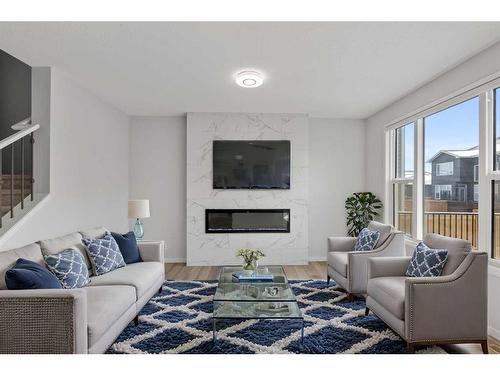 67 Seton Villas Se, Calgary, AB - Indoor Photo Showing Living Room With Fireplace