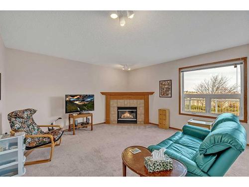 173 Coral Springs Court Ne, Calgary, AB - Indoor Photo Showing Living Room With Fireplace