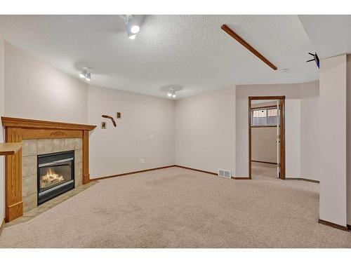 173 Coral Springs Court Ne, Calgary, AB - Indoor With Fireplace