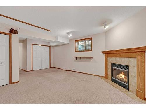 173 Coral Springs Court Ne, Calgary, AB - Indoor With Fireplace