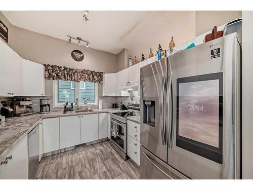 75 River Rock Way Se, Calgary, AB - Indoor Photo Showing Kitchen With Stainless Steel Kitchen