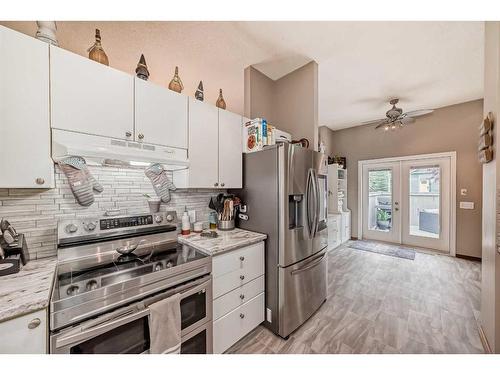 75 River Rock Way Se, Calgary, AB - Indoor Photo Showing Kitchen With Stainless Steel Kitchen With Upgraded Kitchen