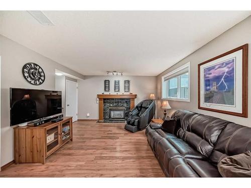 75 River Rock Way Se, Calgary, AB - Indoor Photo Showing Living Room With Fireplace