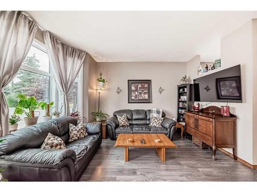 75 River Rock Way Se, Calgary, AB - Indoor Photo Showing Living Room