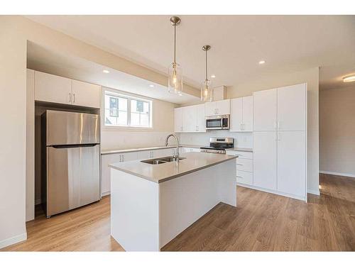 117 South Point Manor Sw, Airdrie, AB - Indoor Photo Showing Kitchen With Stainless Steel Kitchen With Double Sink With Upgraded Kitchen