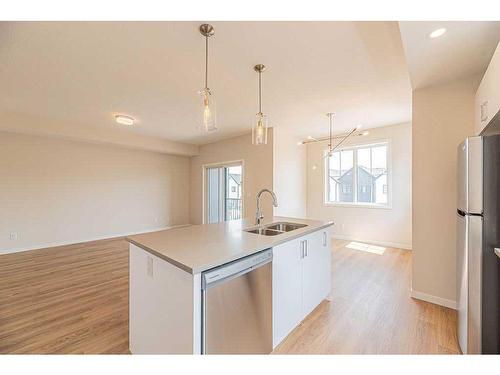 117 South Point Manor Sw, Airdrie, AB - Indoor Photo Showing Kitchen With Stainless Steel Kitchen With Double Sink