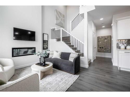 8 Key Cove Sw, Airdrie, AB - Indoor Photo Showing Living Room With Fireplace