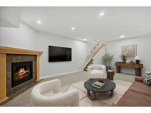 200 Prestwick Manor Se, Calgary, AB - Indoor Photo Showing Living Room With Fireplace