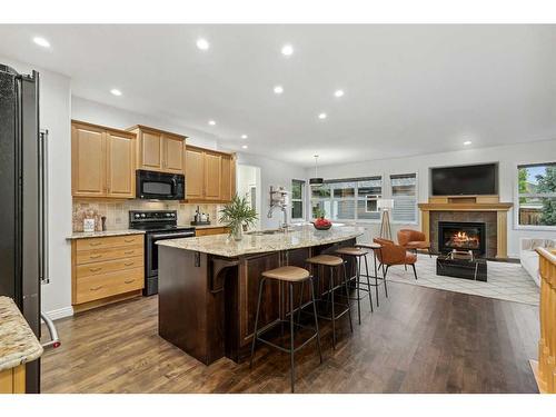 200 Prestwick Manor Se, Calgary, AB - Indoor Photo Showing Kitchen With Fireplace With Stainless Steel Kitchen With Upgraded Kitchen