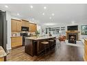 200 Prestwick Manor Se, Calgary, AB  - Indoor Photo Showing Kitchen With Fireplace With Stainless Steel Kitchen With Upgraded Kitchen 