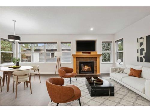 200 Prestwick Manor Se, Calgary, AB - Indoor Photo Showing Living Room With Fireplace