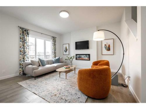 44 Key Cove Sw, Airdrie, AB - Indoor Photo Showing Living Room With Fireplace