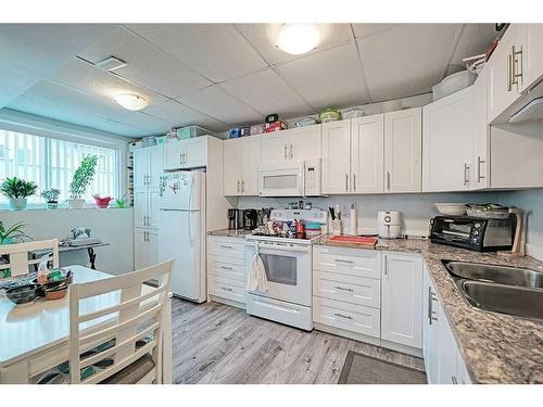 539 Pioneer Drive, Irricana, AB - Indoor Photo Showing Kitchen With Double Sink